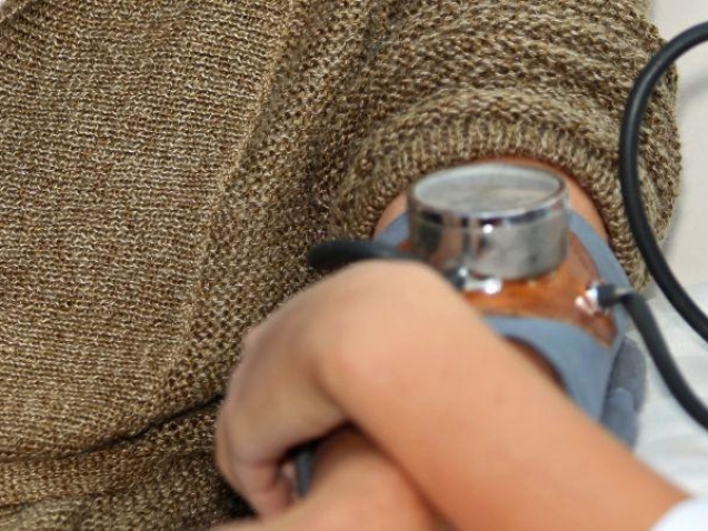 Doctor taking blood pressure